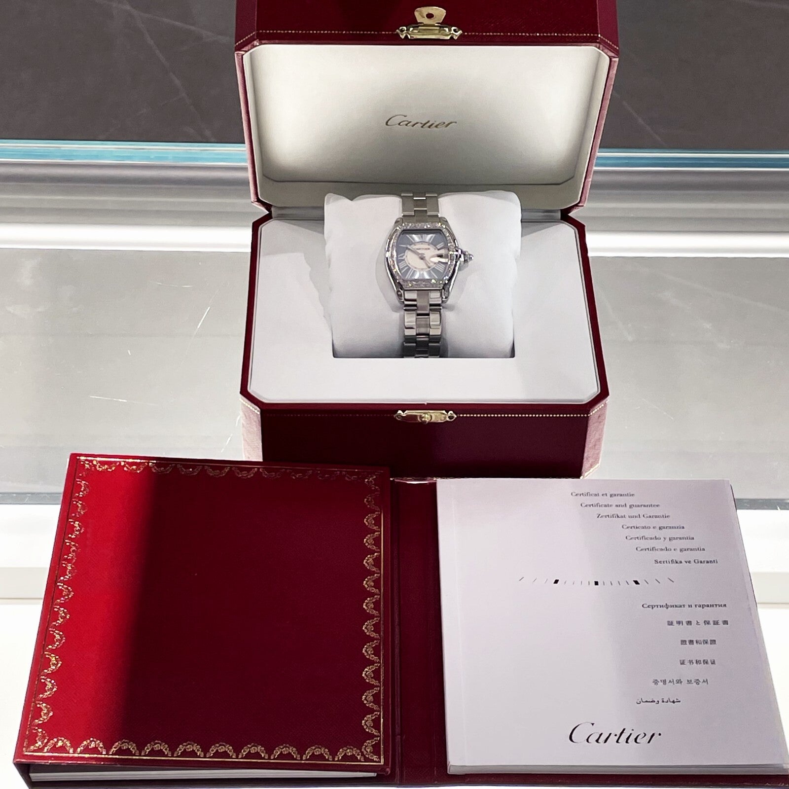 CARTIER ROADSTER LADIES BLUE ROMAN DIAMOND BEZEL STAINLESS ref: W62053V3